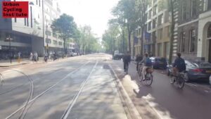 Interactions and Negotiation in motion image showing cyclists on a car free road in Amsterdam