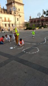 children - road safety - human footprint - featured image showing kids playing on a square
