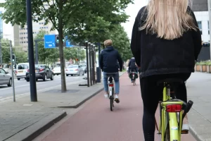 urban surroundings image showing cyclists on a bike lane