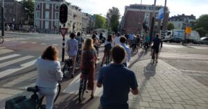 a line of cyclists in Amsterdam
