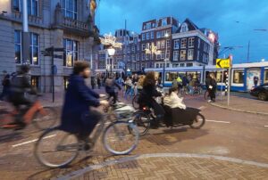 cyclists by night in Amsterdam
