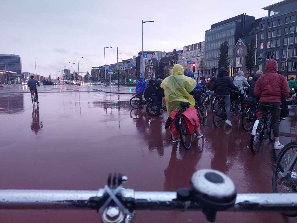 cyclists in the rain as featured image for ethnography in cycling research