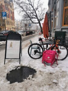 bicycle courier waiting in the snow